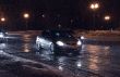 Cars in night blizzard.