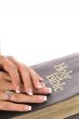 female hands on a bible