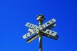 Crossed signs reading `Railway Crossing`