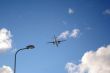 Plane on a blue and cloudy sky