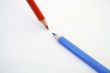 Two pencils on white
