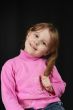 child keeps hairs and smiles