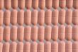 Rows of pink pills over grey
