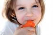 happy girl eatin carrots