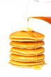 Pouring syrup on the pancakes