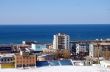 The City on background of the blue ocean