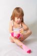 Small girl is puting on the socks