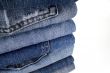stask of blue jeans