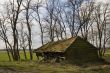 broken farmhouse in landscape