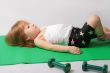 Small girl is tired to make power training.