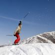 Snow Skier jumping over blue sky