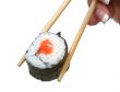 female hand holding sushi