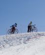 Couple of professional bikers in mountains