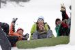 Group of sports teenagers snowborders in snow