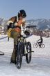 Biker in helmet in winter mountains Tien Shan
