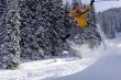 Snow Skier Jumping in winter forest