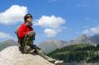 Teenager boy in sport pullover in mountain hike