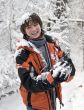 boy in scarf with snowball