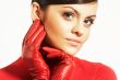 Atractive brunet in red blouse and red gloves