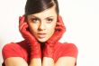 Atractive brunet in red blouse and red gloves