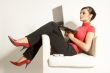 Atractive brunet businesswoman with Laptop and phone