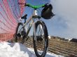 Bike in winter over blue sky