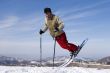 Snow Skier Jumping Against Blue Sky