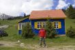 Man near to mountain house