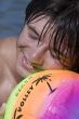 Teenager with ball on the beach