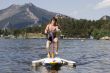 Teenager ride by water bicycle