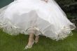 beautiful legs and white skirt of wedding dress