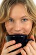 Charming young woman drinking tea