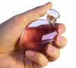 Bottle of parfume in hand