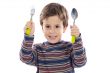 Child with a spoon and fork