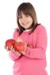 Adorable girl with red apples