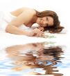 happy brunette on white sand