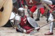 Are wounded the knight lays on the ground