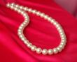 Pearl necklace on a red background