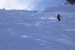 Red skier in powder snow