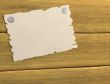 3d sheet of a paper, attached by buttons to board