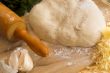 pizza dough and rolling pin