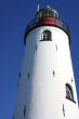 White lighthouse, blue sky.