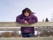 Girl Posing On A Wooden Bridge