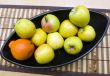 Black Japanese vase with apples and tangerine