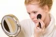 Woman looking in mirror
