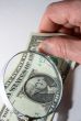 Magnifying glass and dollar
