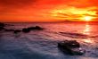 Amazing sunset over rocky seascape