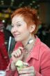 woman eating ice cream in cafe and smiling happy