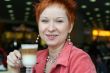 woman dreanking coffe in cafe and smiling happy