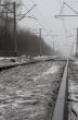 Dirty snow on raiway tracks.